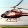 A helicopter hovering above the ground